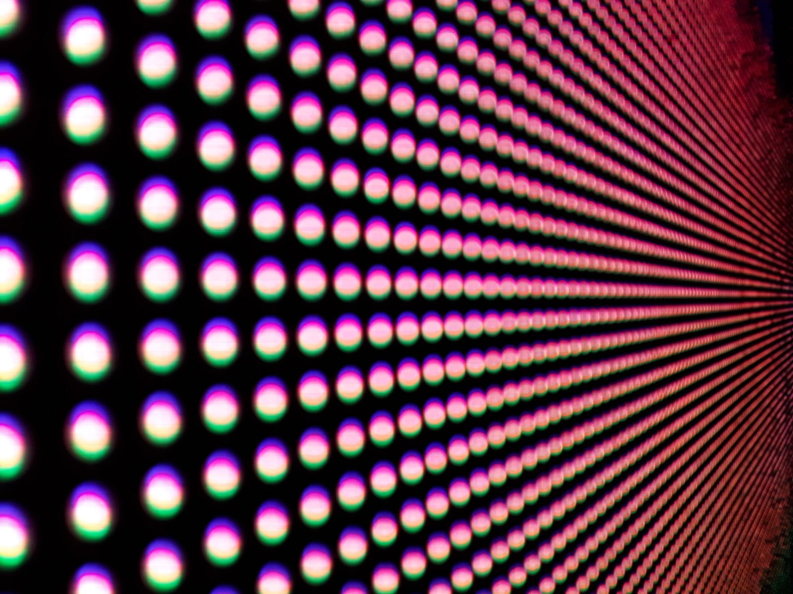 Background of colorful luminous circles, close-up of a led screen.