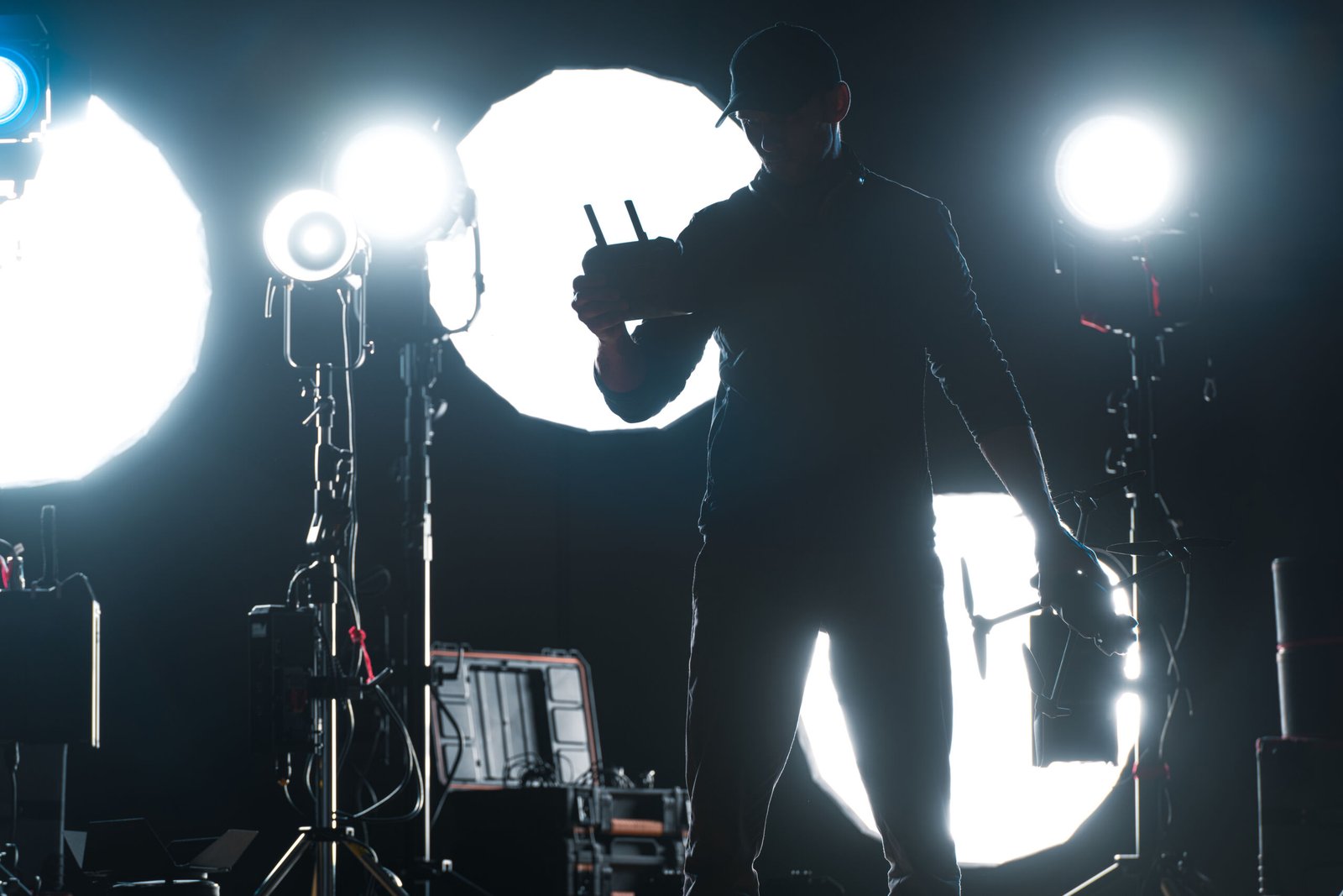 A man adjusting stage lighting pre-show